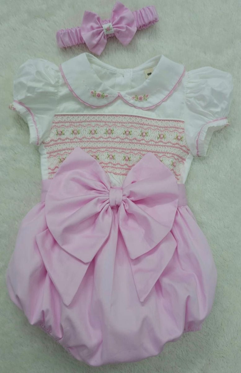 Pink smocked romper comes with matching hair bows or headband for baby sizes