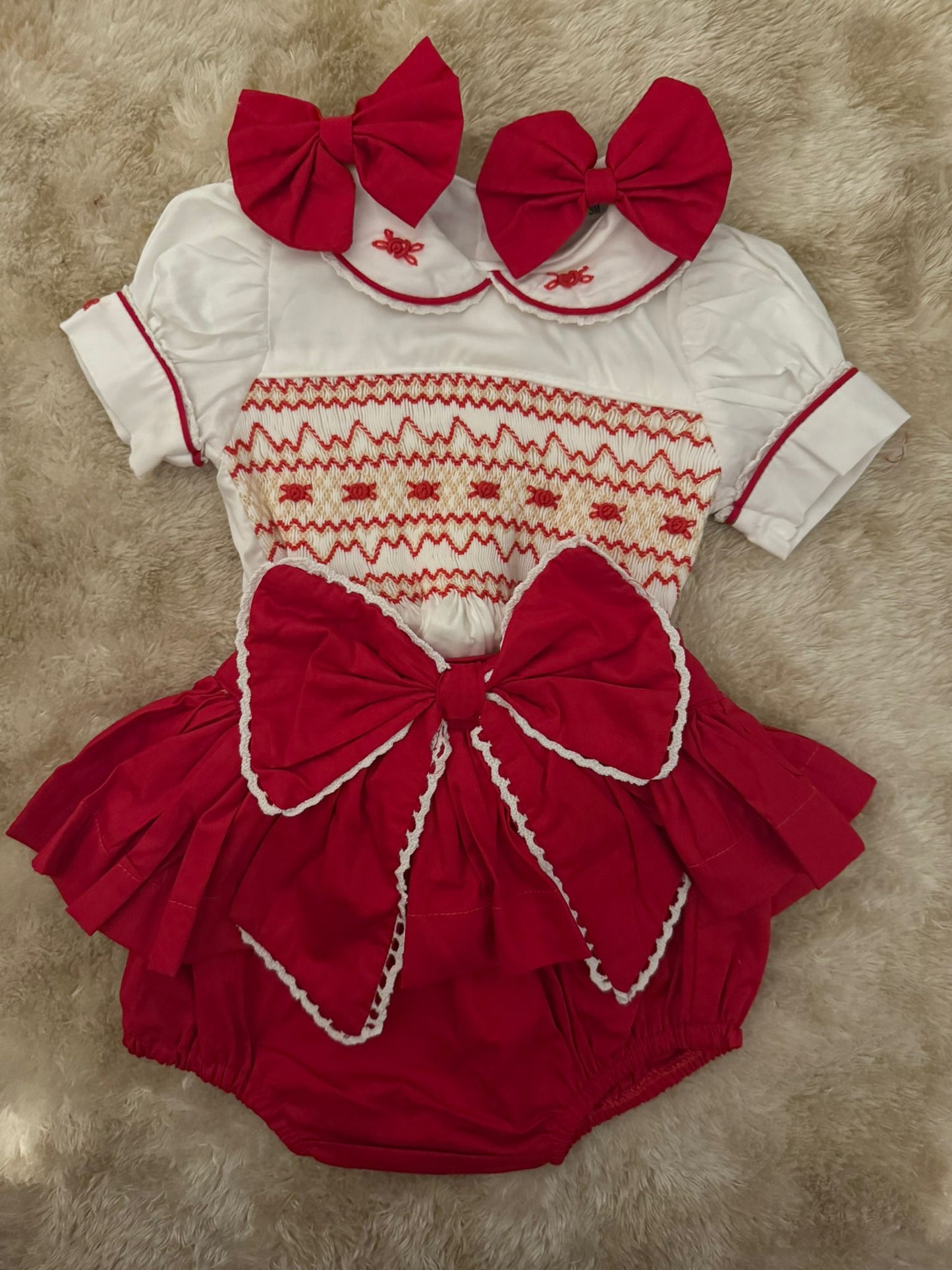 Red smocked skirt romper