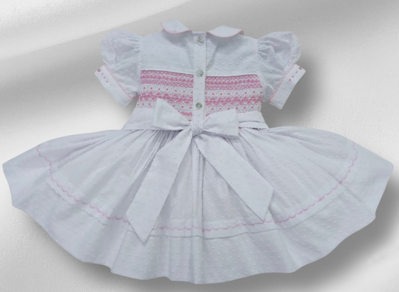 White Smocked back and front Swiss dot with pink