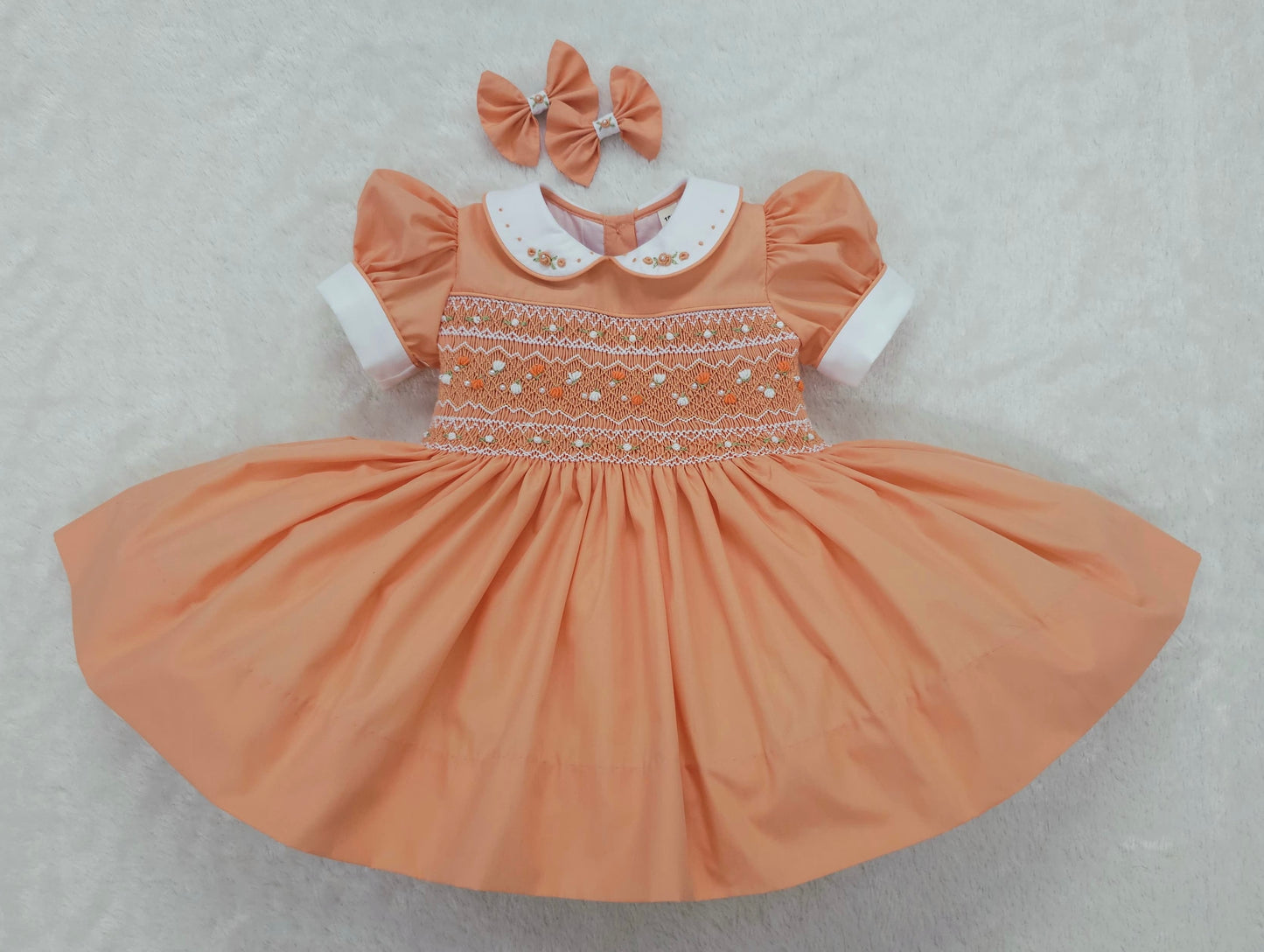 Orange/Coral smocked dress with pearls