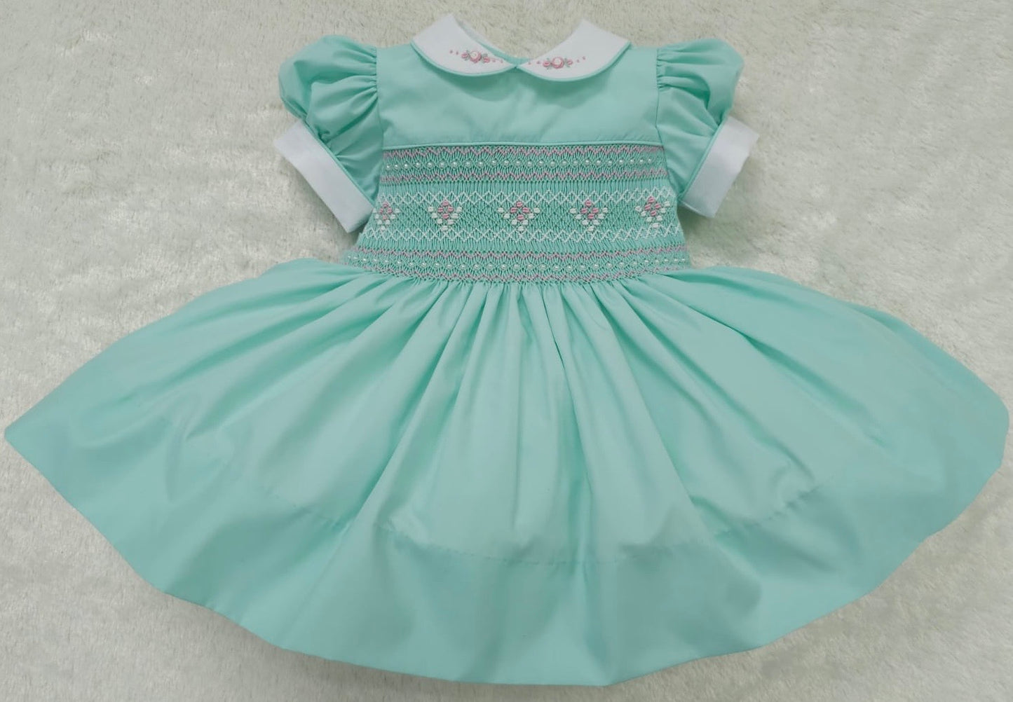 Mint with pink smocking and pearls