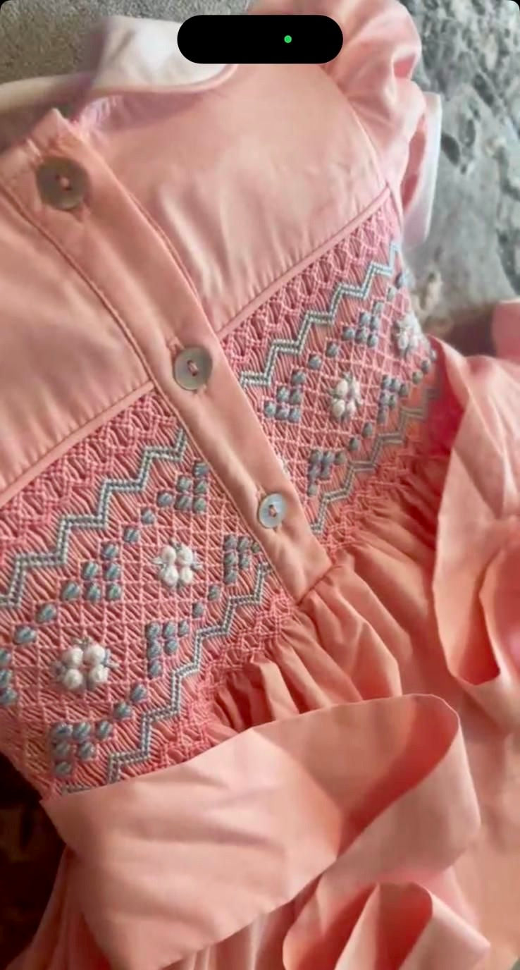 Peach coral smocked back and front with blue and white smocking