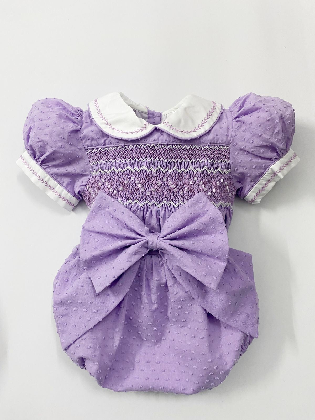 Luxe lilac Swiss dot smocked romper