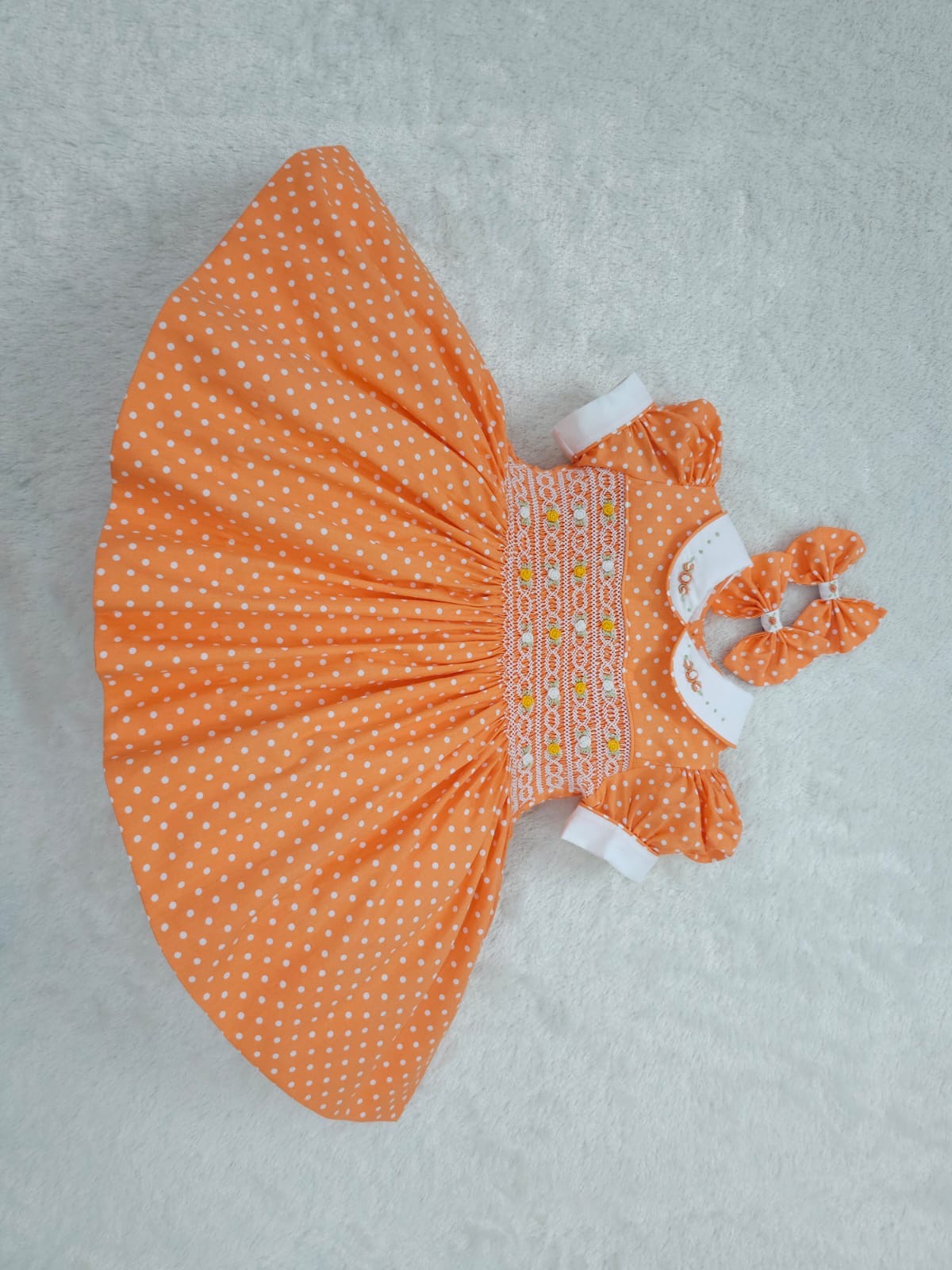 Orange polkadot smocked dress