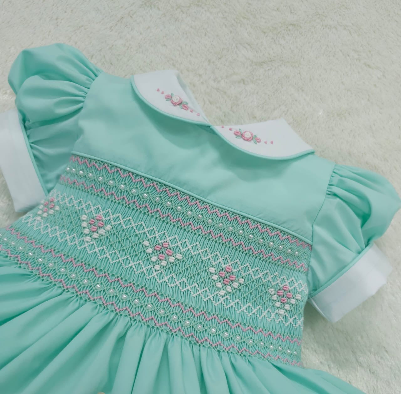 Mint with pink smocking and pearls