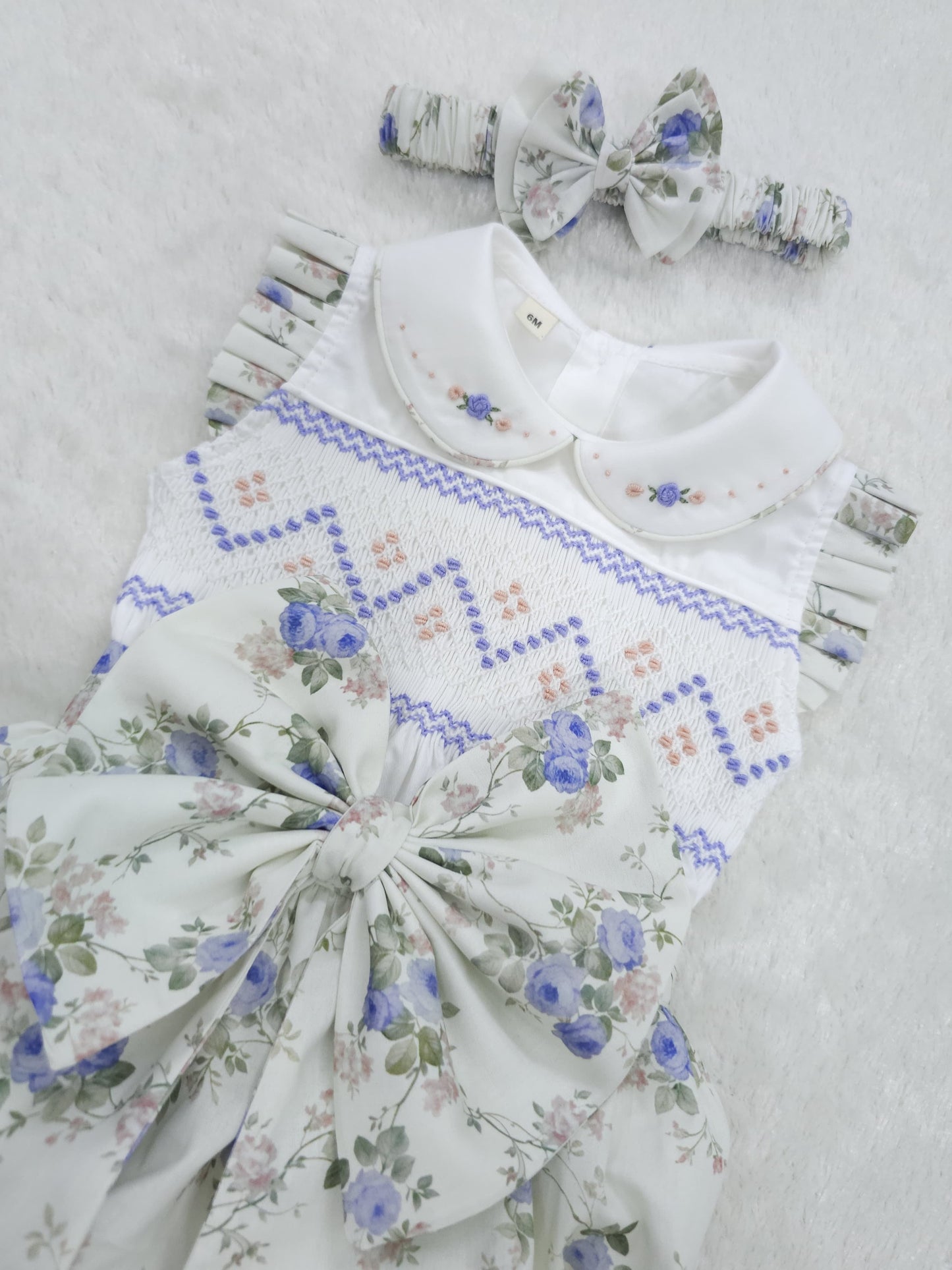 Lilac floral sleeveless hand smocked girls romper
