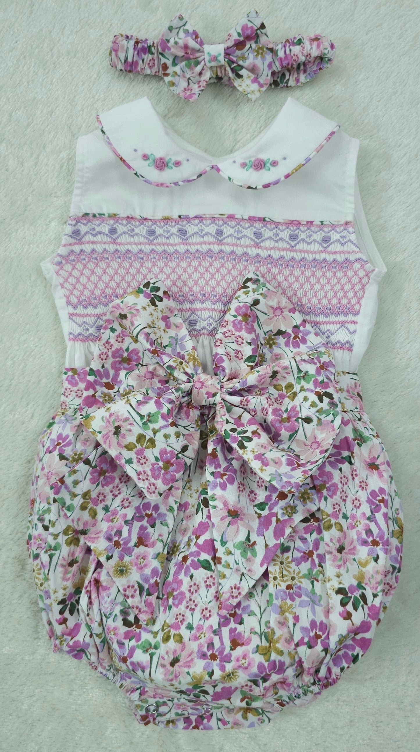 Lilac and pink floral sleeveless smocked romper