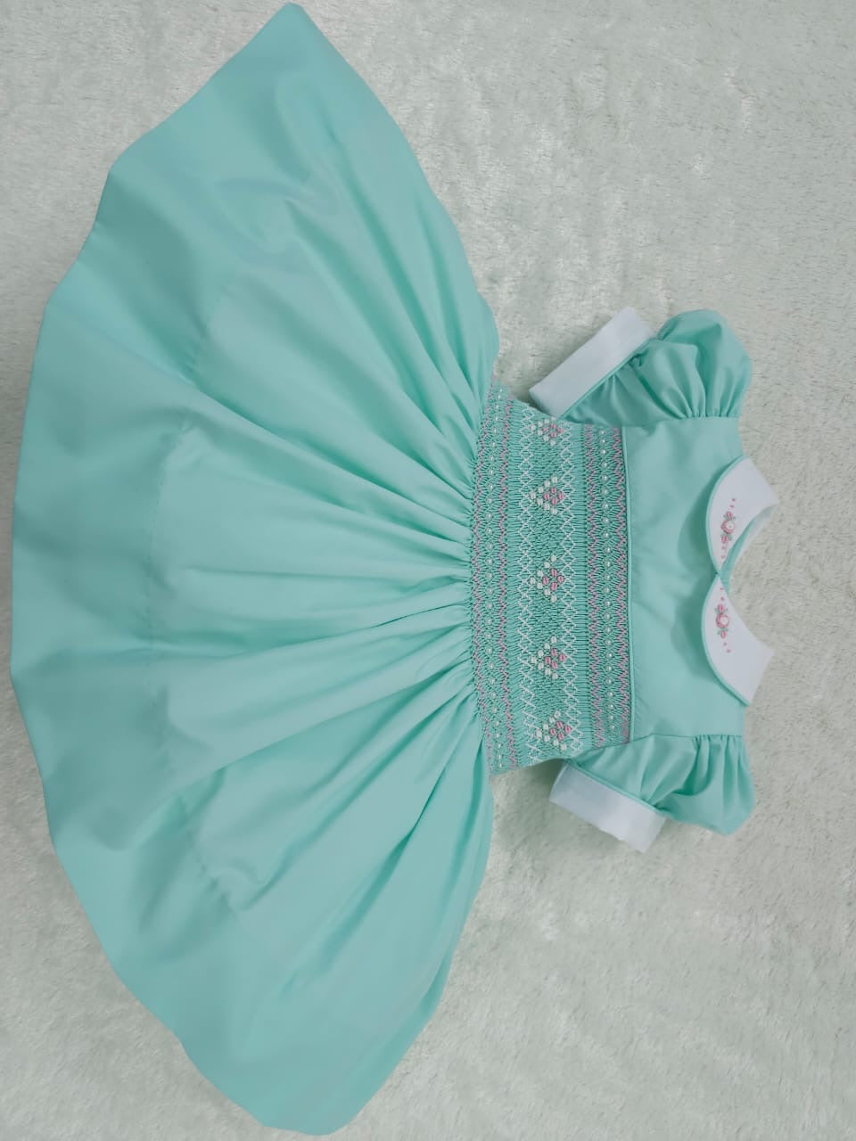Mint with pink smocking and pearls