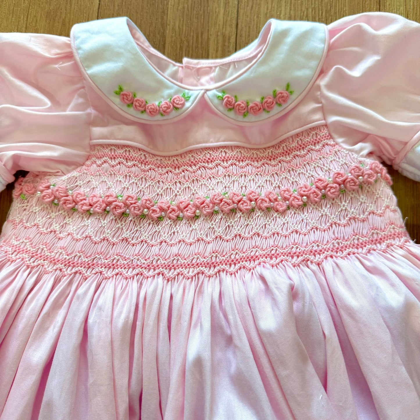 Pink smocked back and front with roses and pearls