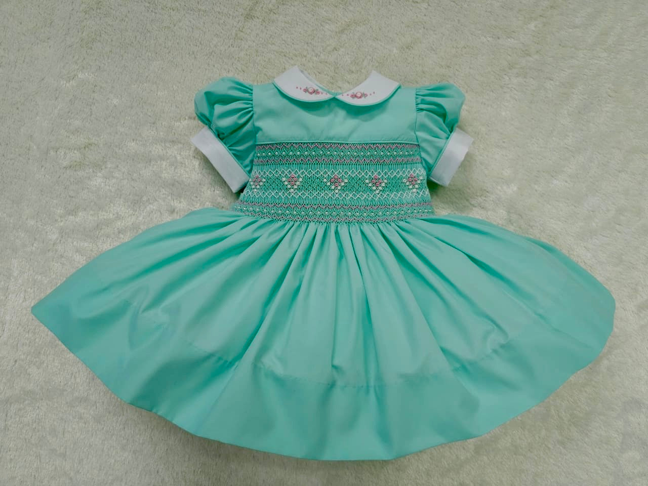 Mint with pink smocking and pearls