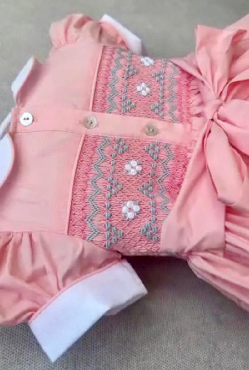 Peach coral smocked back and front with blue and white smocking