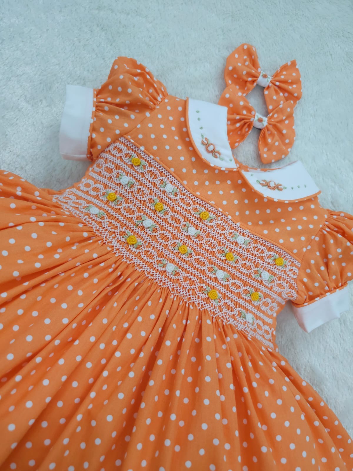 Orange polkadot smocked dress