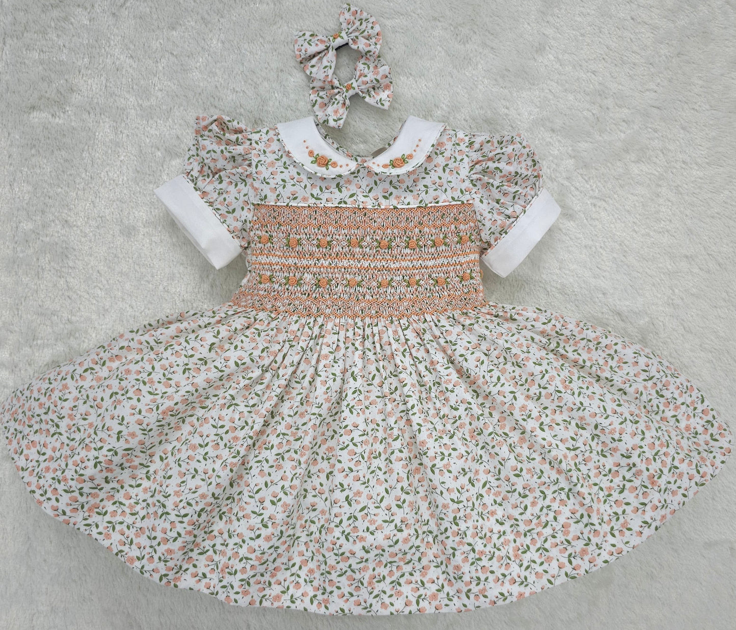 Floral smocked dress with peach embroidered flowers