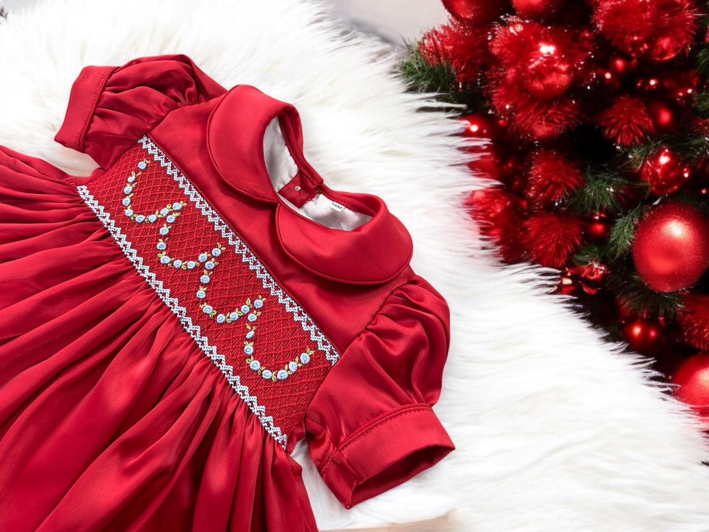 Red satin hand smocked pyjamas with blue garland