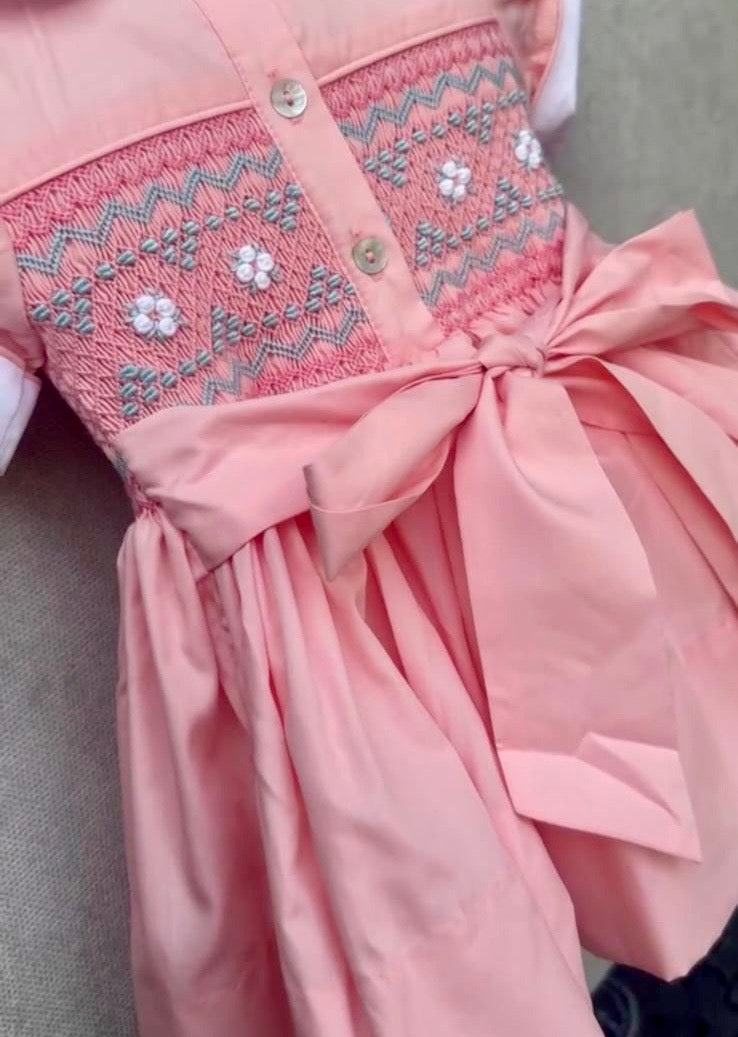 Peach coral smocked back and front with blue and white smocking