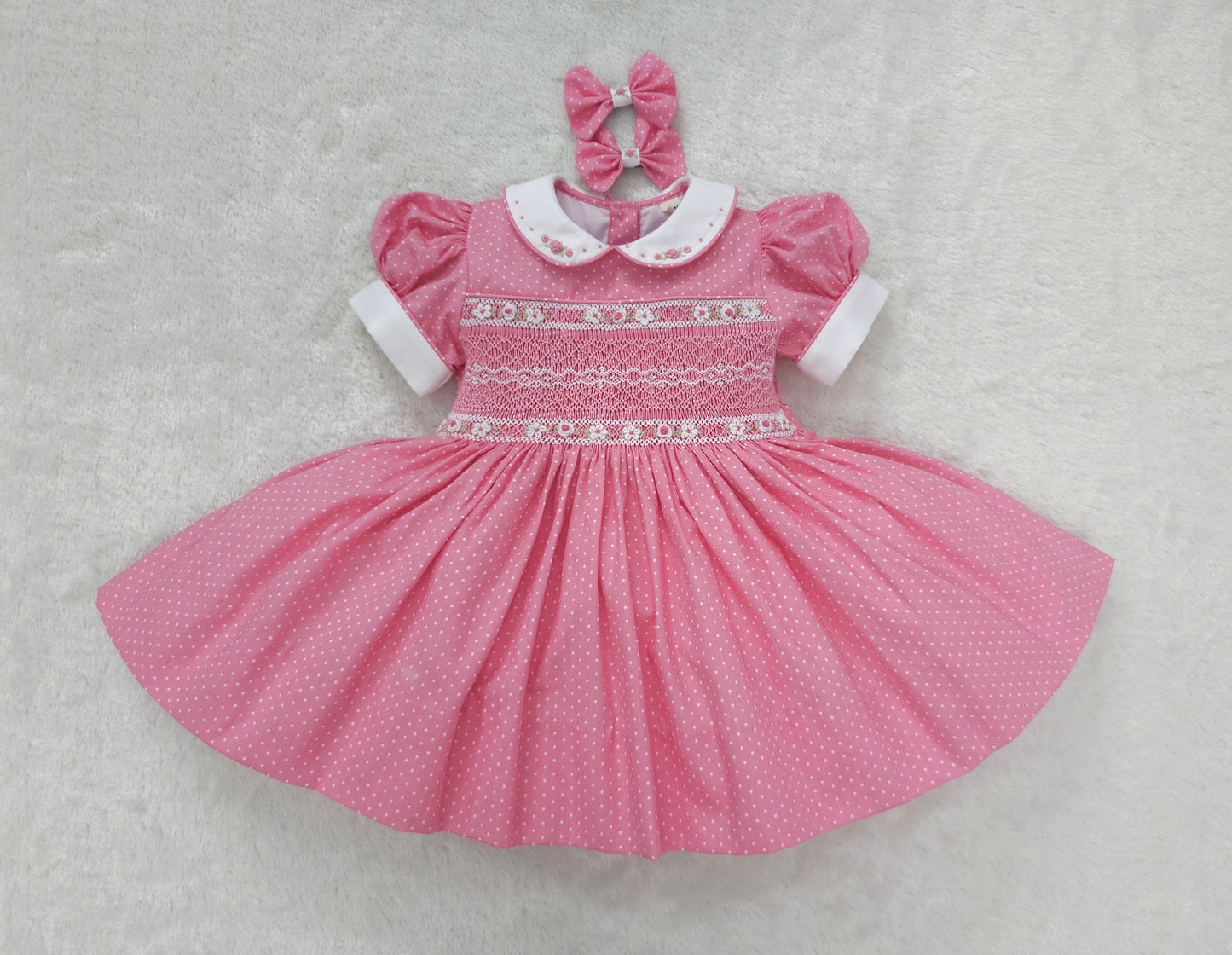 Pink polkadot with white smocking and embroidery ( got matching romper available )