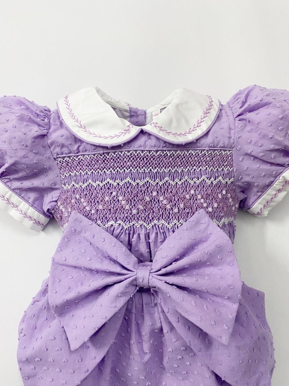 Luxe lilac Swiss dot smocked romper