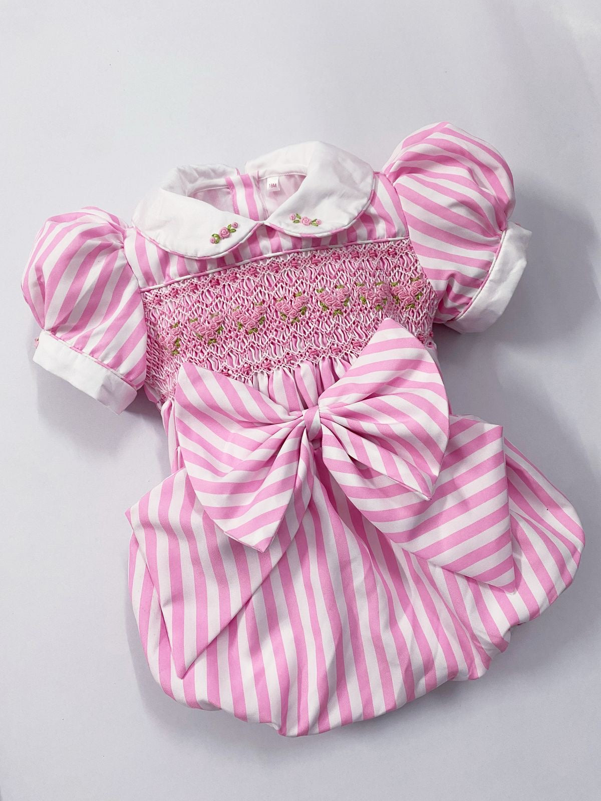 Pink luxe stripe smocked romper comes with hair bow