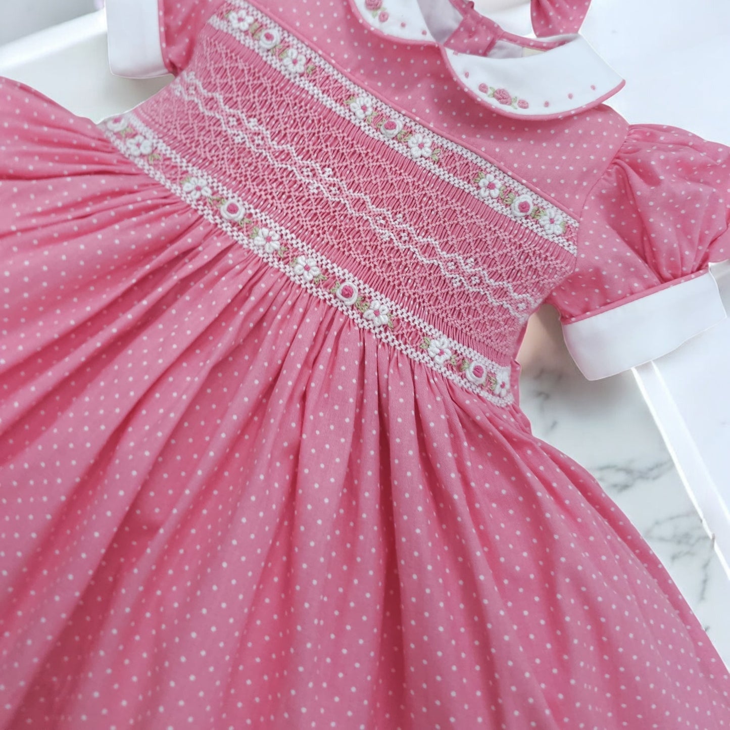 Pink polkadot with white smocking and embroidery ( got matching romper available )