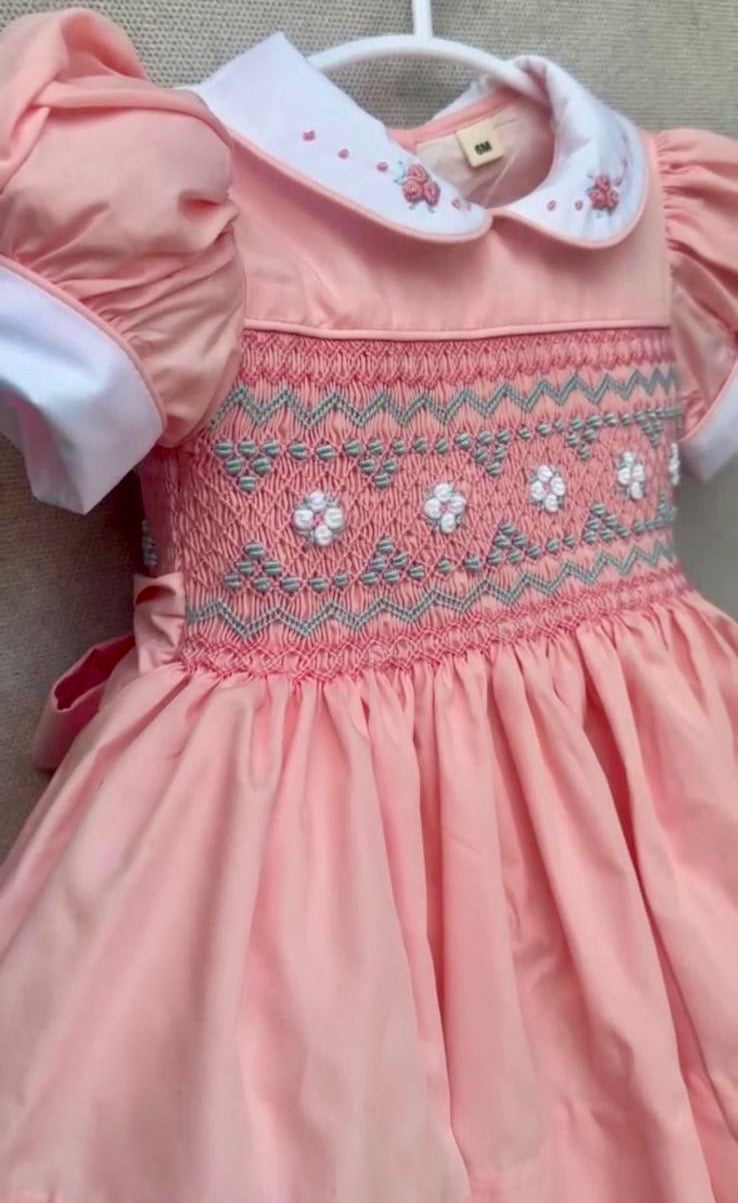 Peach coral smocked back and front with blue and white smocking