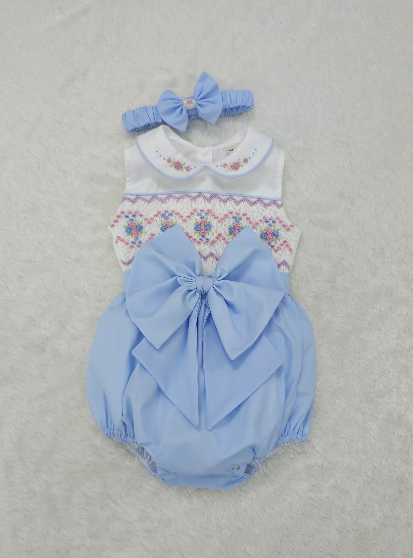Baby blue smocked sleeveless romper