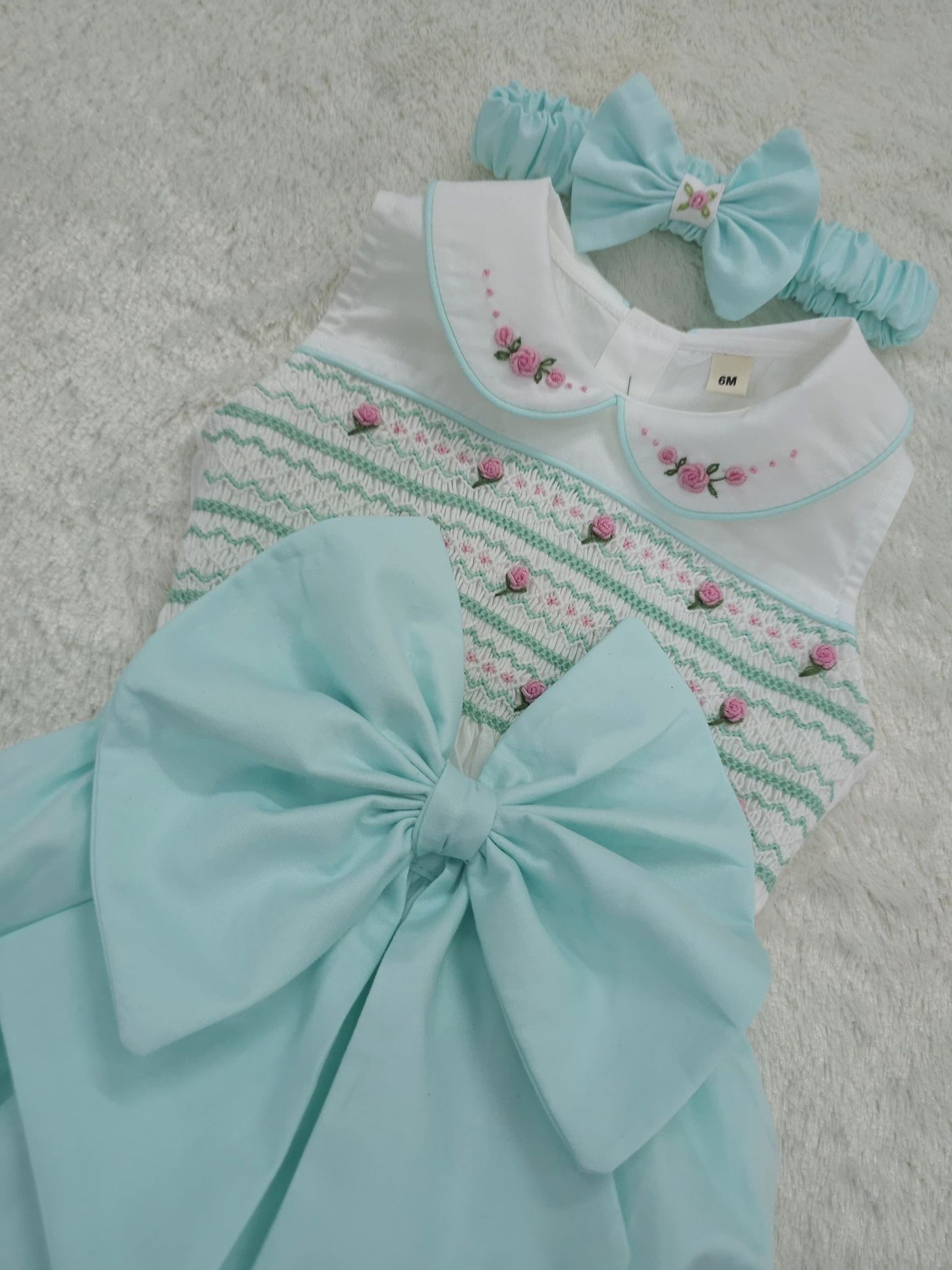 Mint sleeveless smocked romper