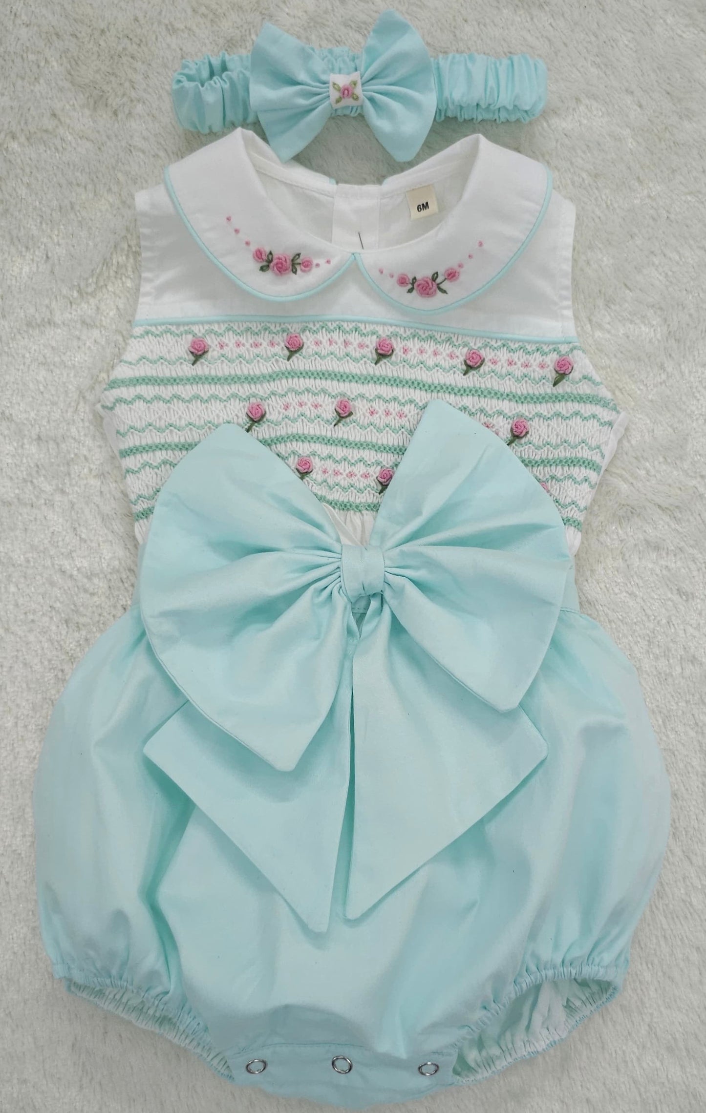 Mint sleeveless smocked romper