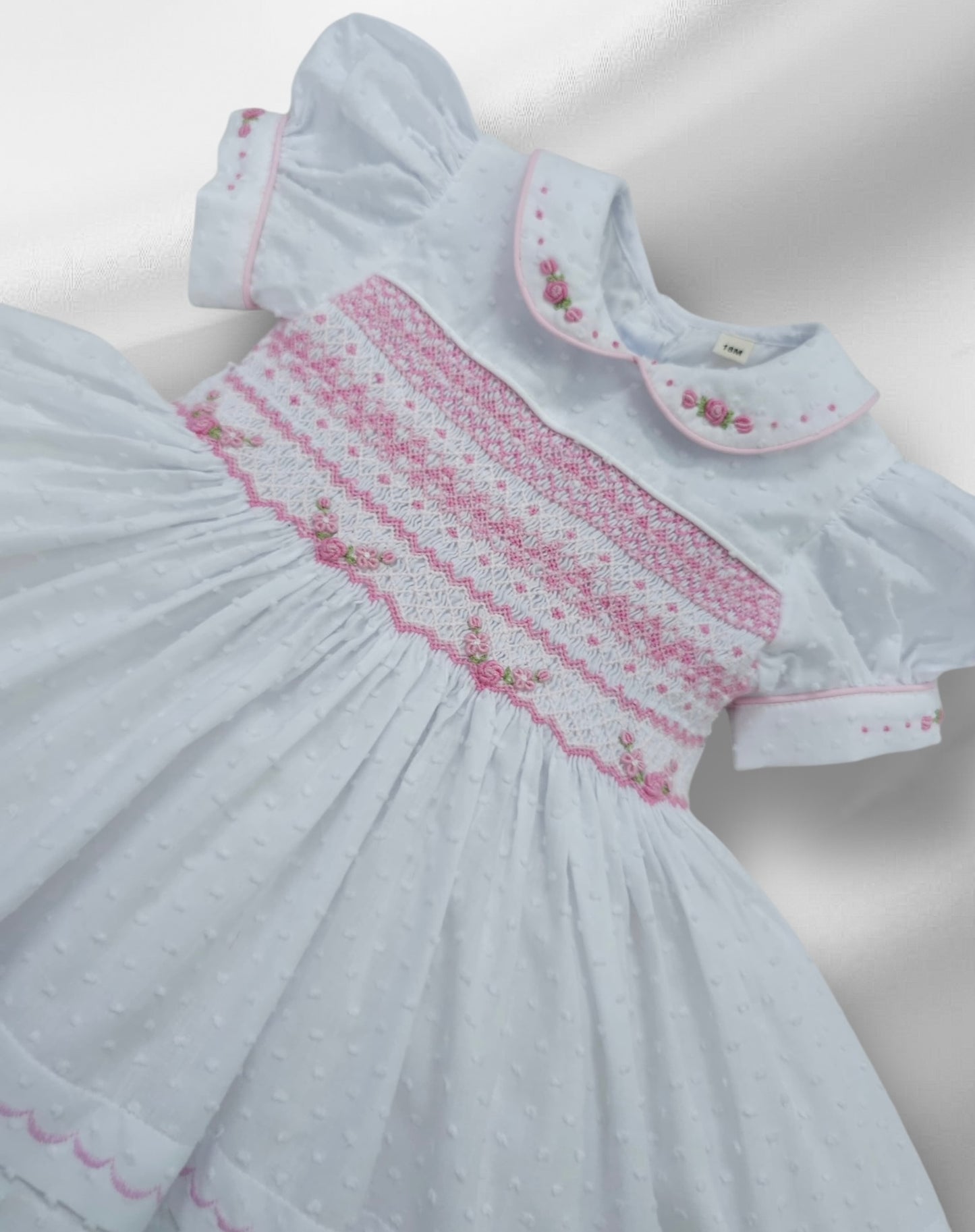 White Smocked back and front Swiss dot with pink