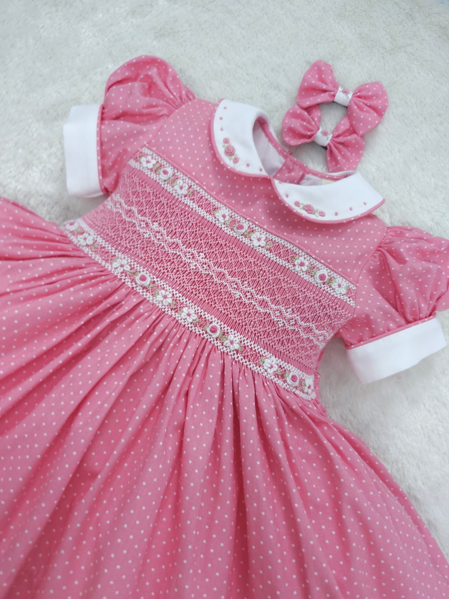 Pink polkadot with white smocking and embroidery ( got matching romper available )