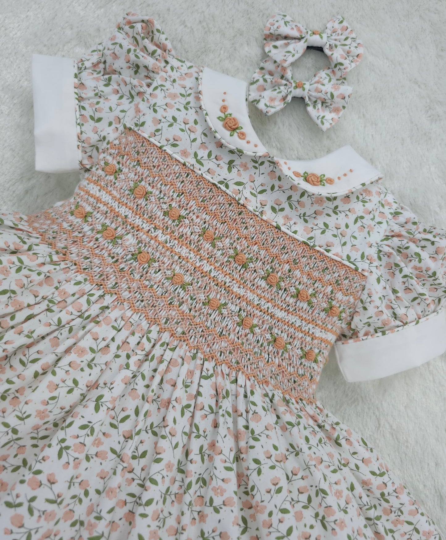 Floral smocked dress with peach embroidered flowers