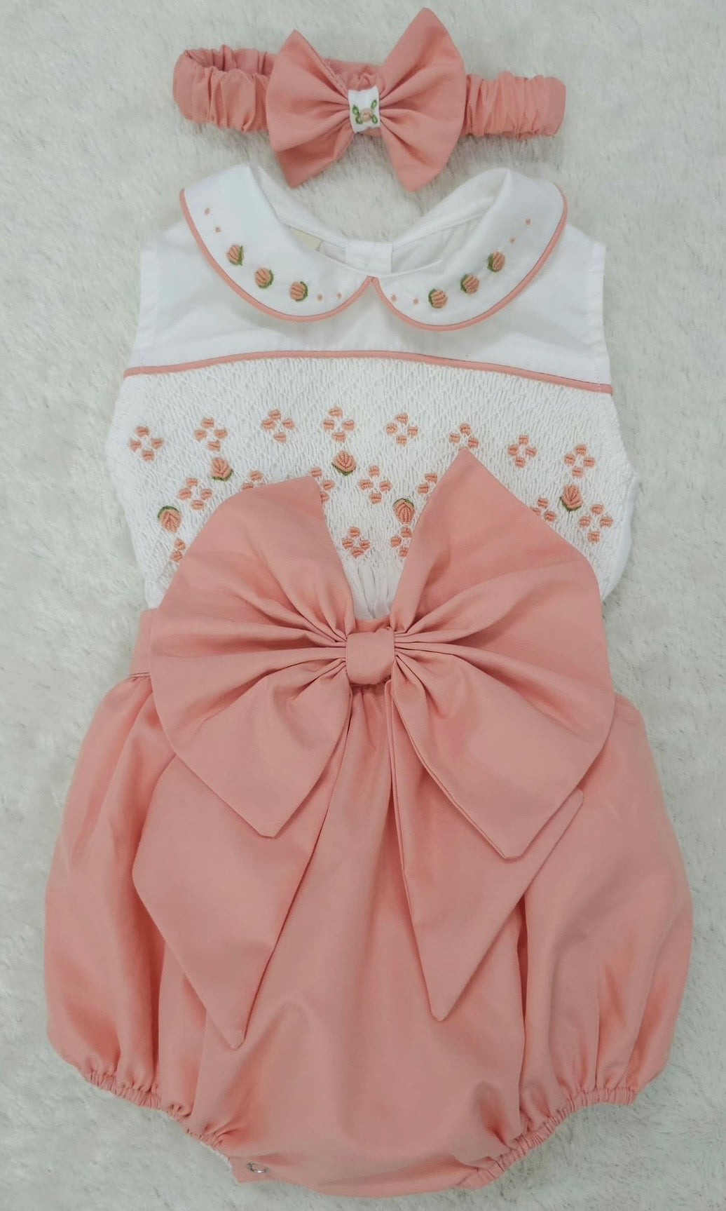 Coral sleeveless smocked romper