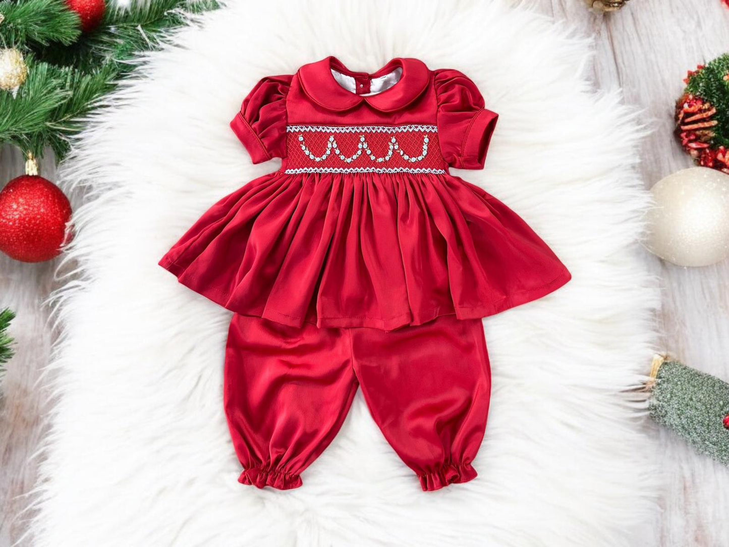 Red satin hand smocked pyjamas with blue garland
