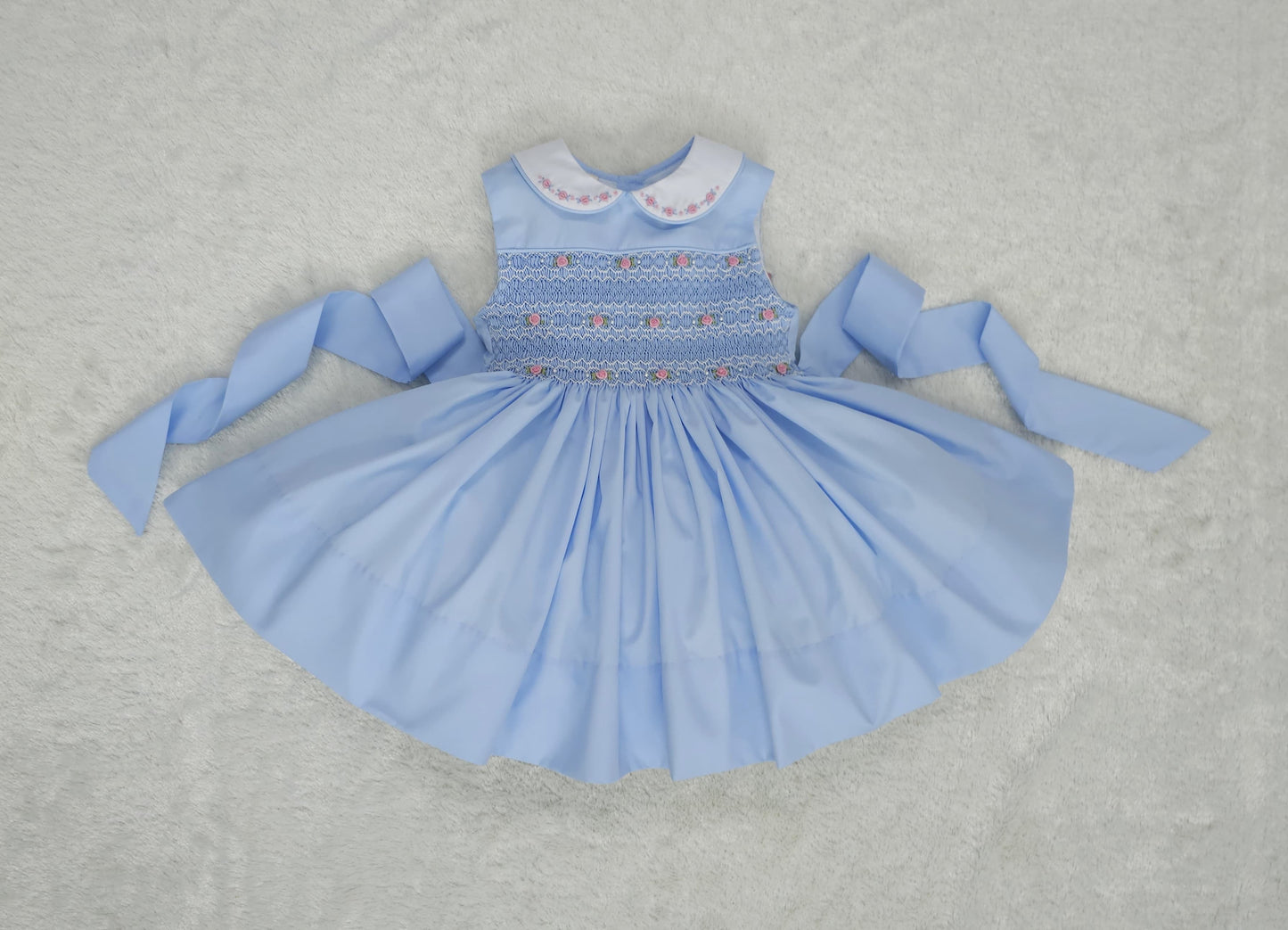 Baby blue smocked sleeveless with pink embroidered roses and pearls
