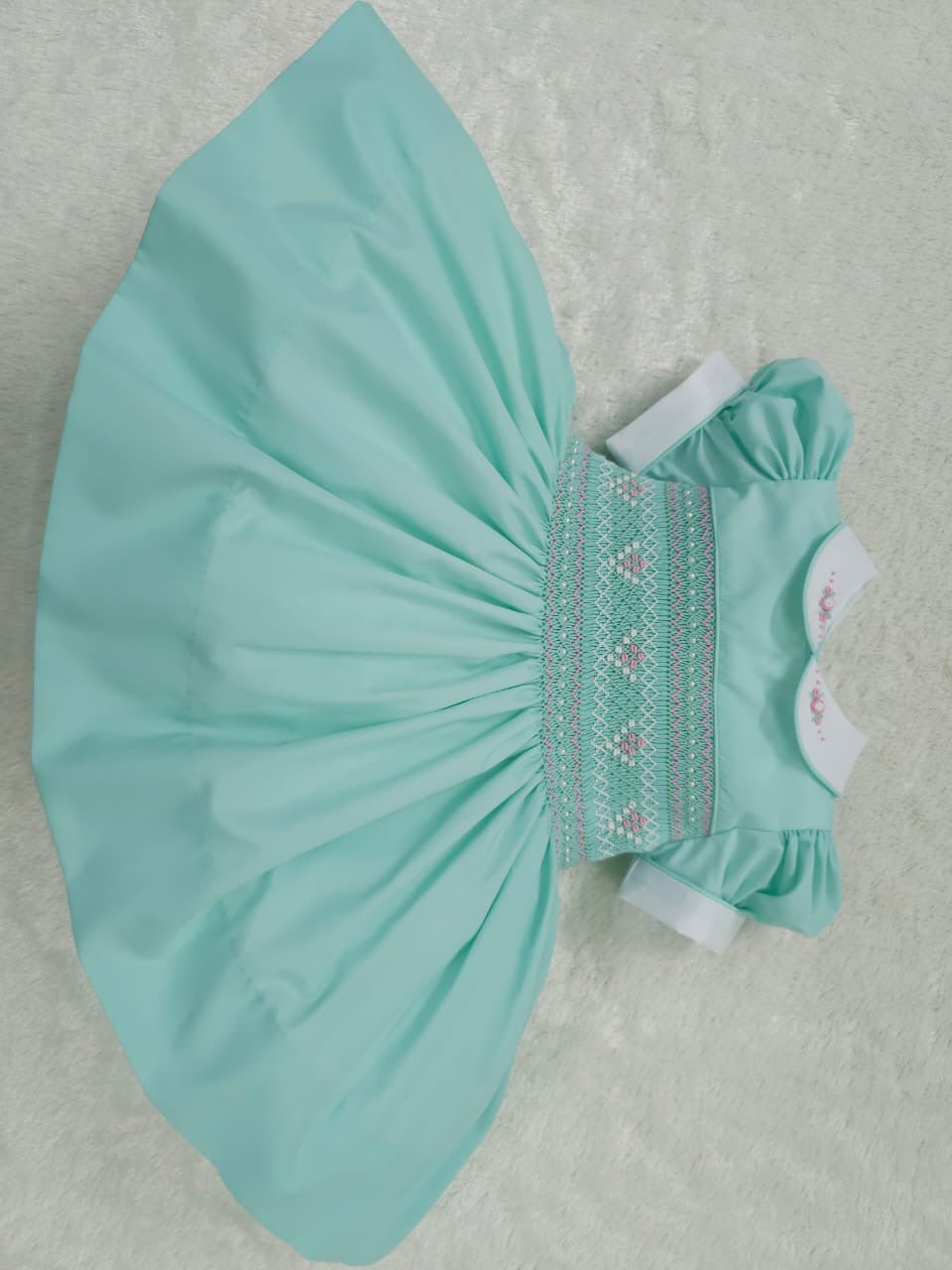 Mint with pink smocking and pearls
