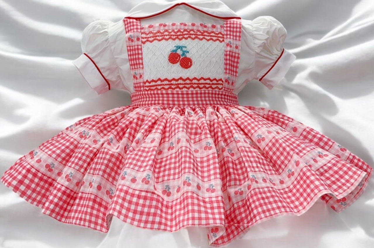 Cherry smocked pinafore dress
