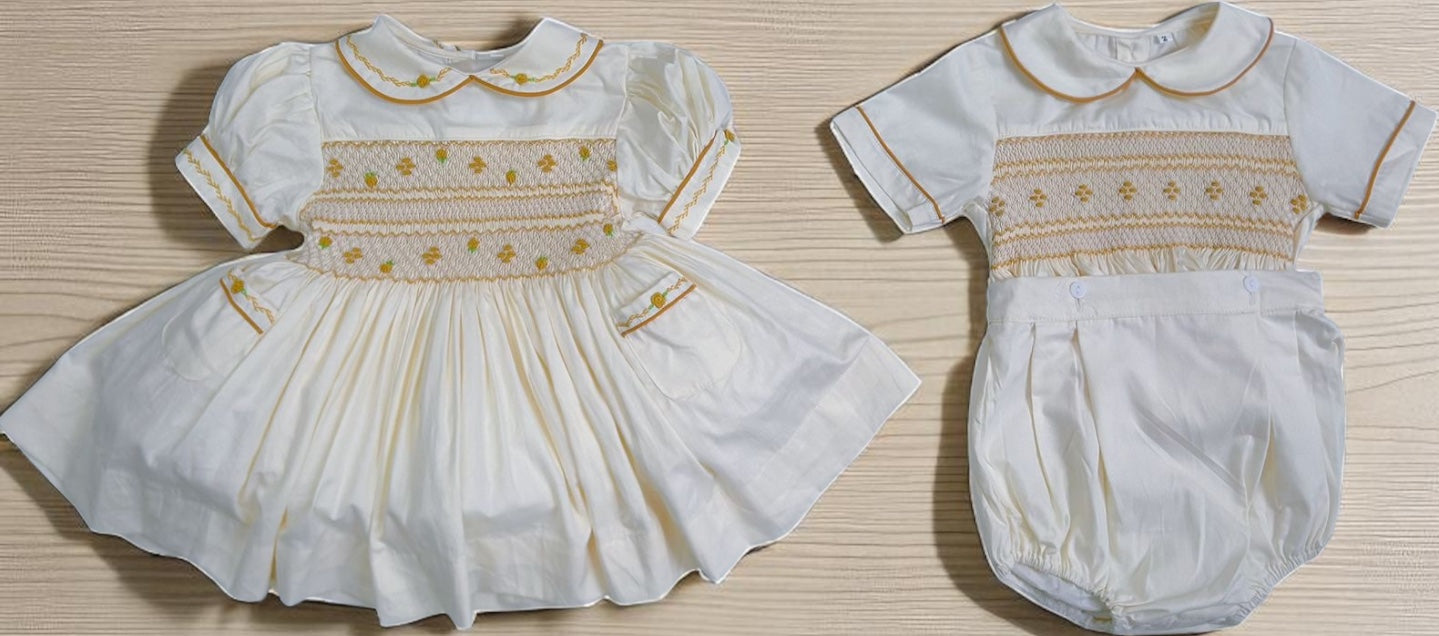 Cream dress with gold smocking & pockets ( got matching boys suit available )