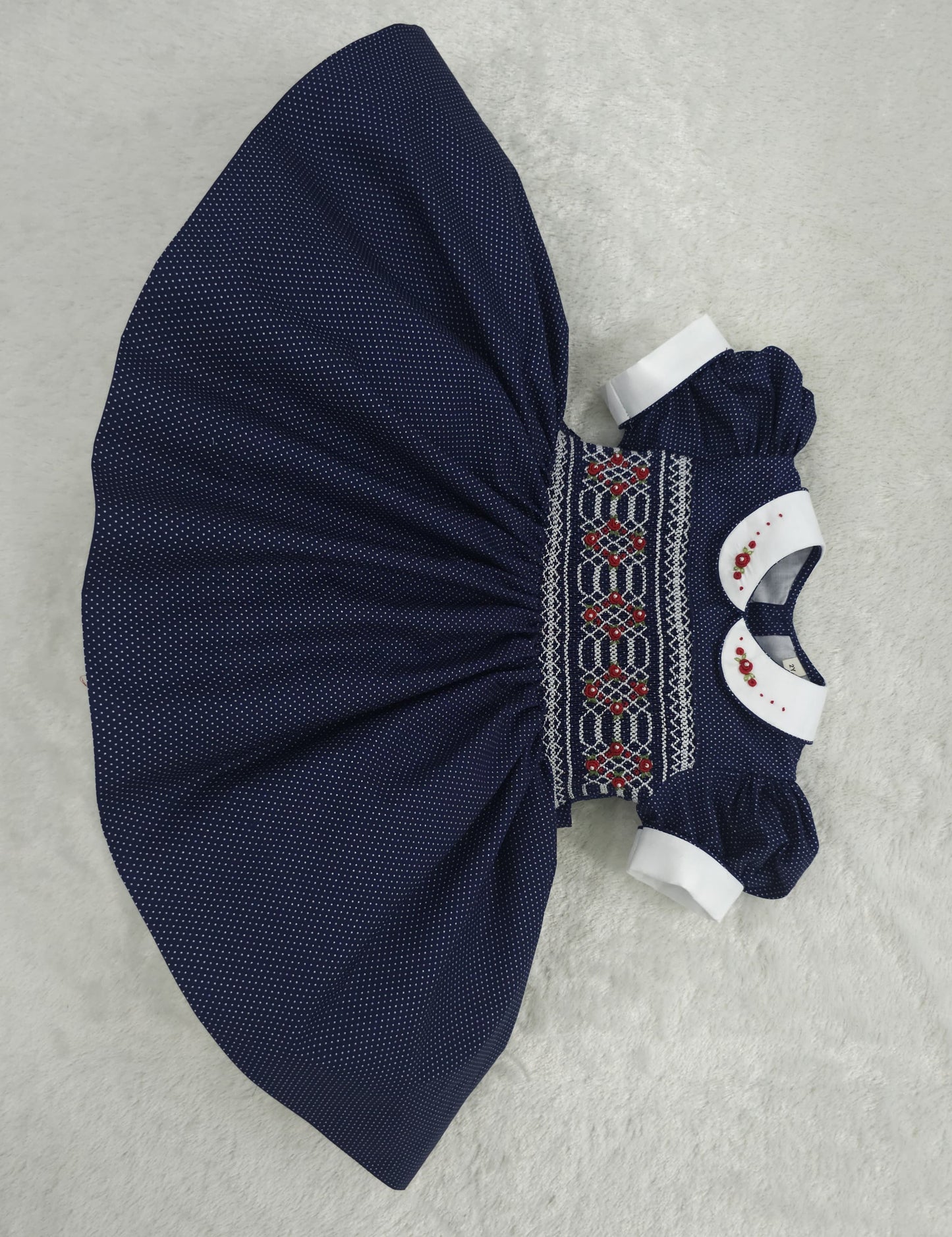 Navy polkadot with red and white smocking ( got matching boys suit available and matching girls romper )
