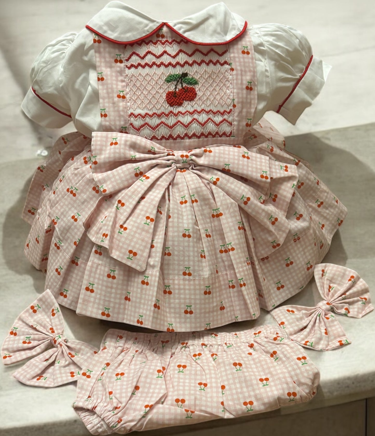 Cherry pinafore comes with knickers and bows