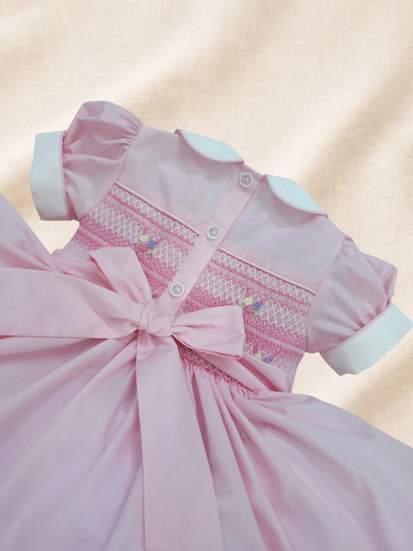 Pink and pastel hand smocked back and front dress