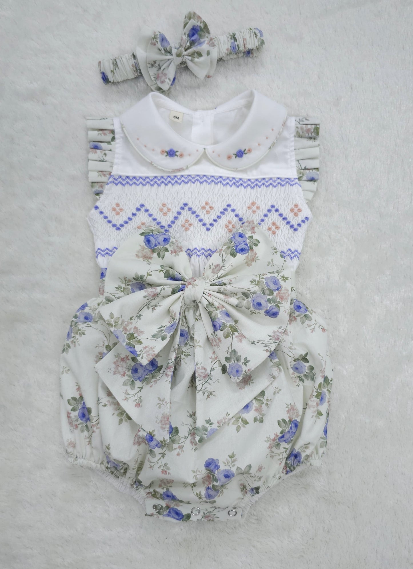 Lilac floral sleeveless hand smocked girls romper
