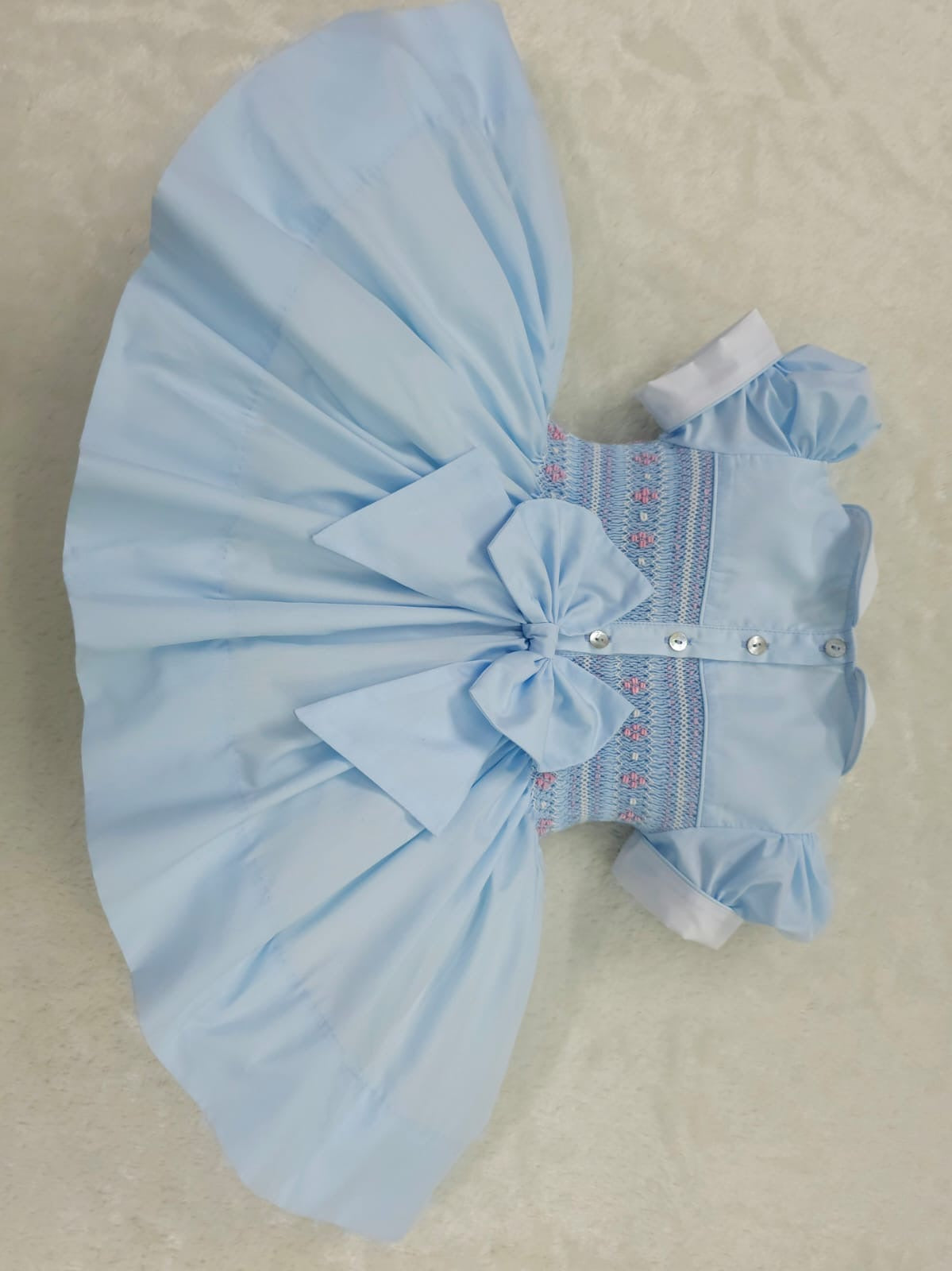 Baby blue smocked back and front