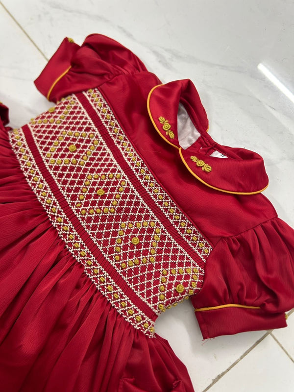 Red satin with gold smocking ( got matching boys suit available)