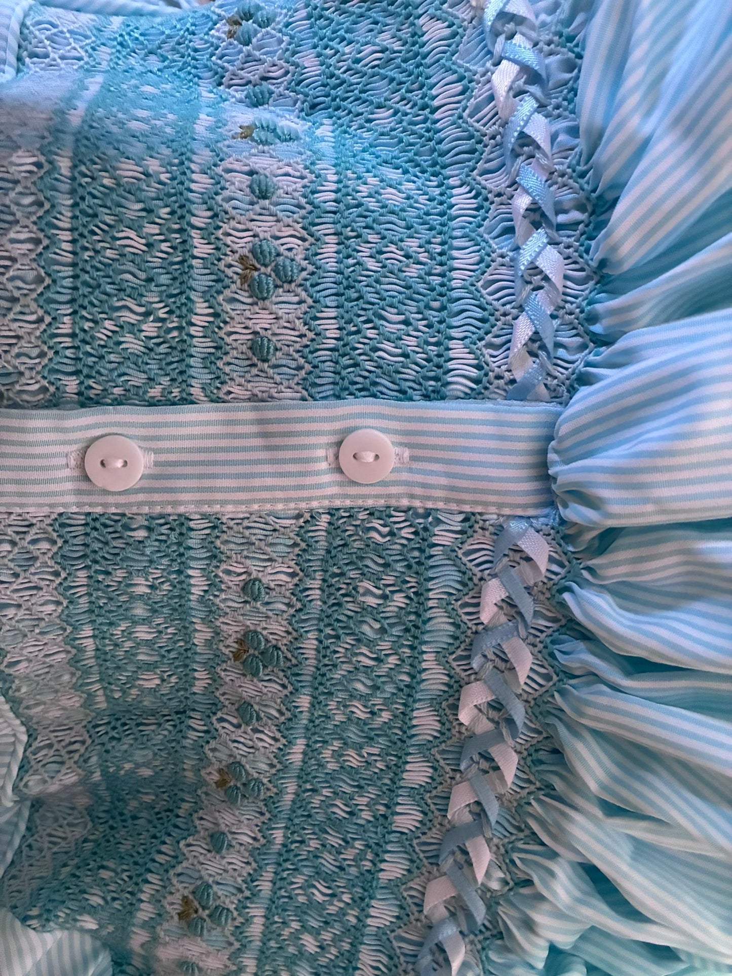 Blue stripe smocked back and front ( got matching boys suit available )