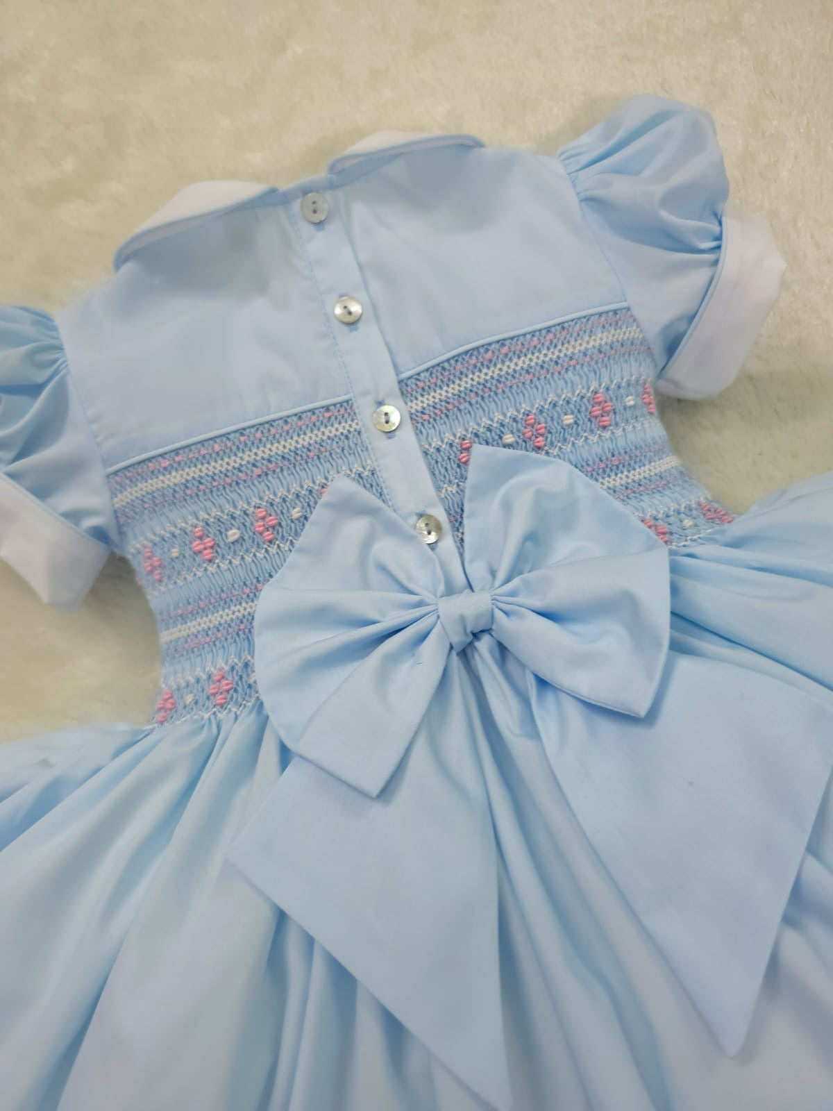 Baby blue smocked back and front