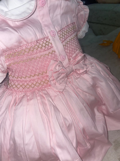 Pink with gold. Smocked back and front