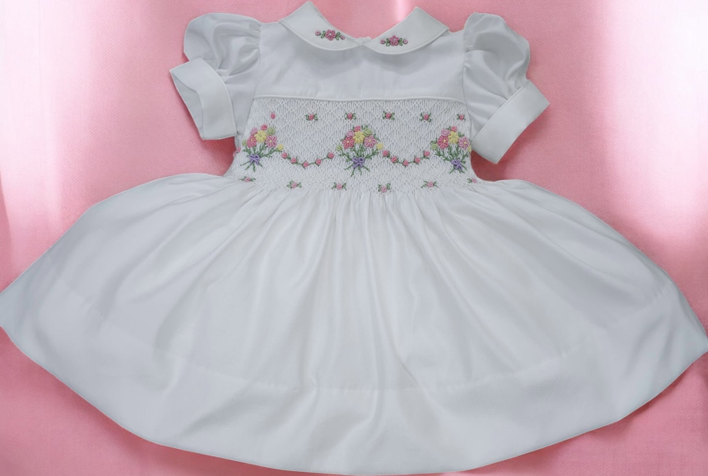 White smocked dress with embroidered flower baskets