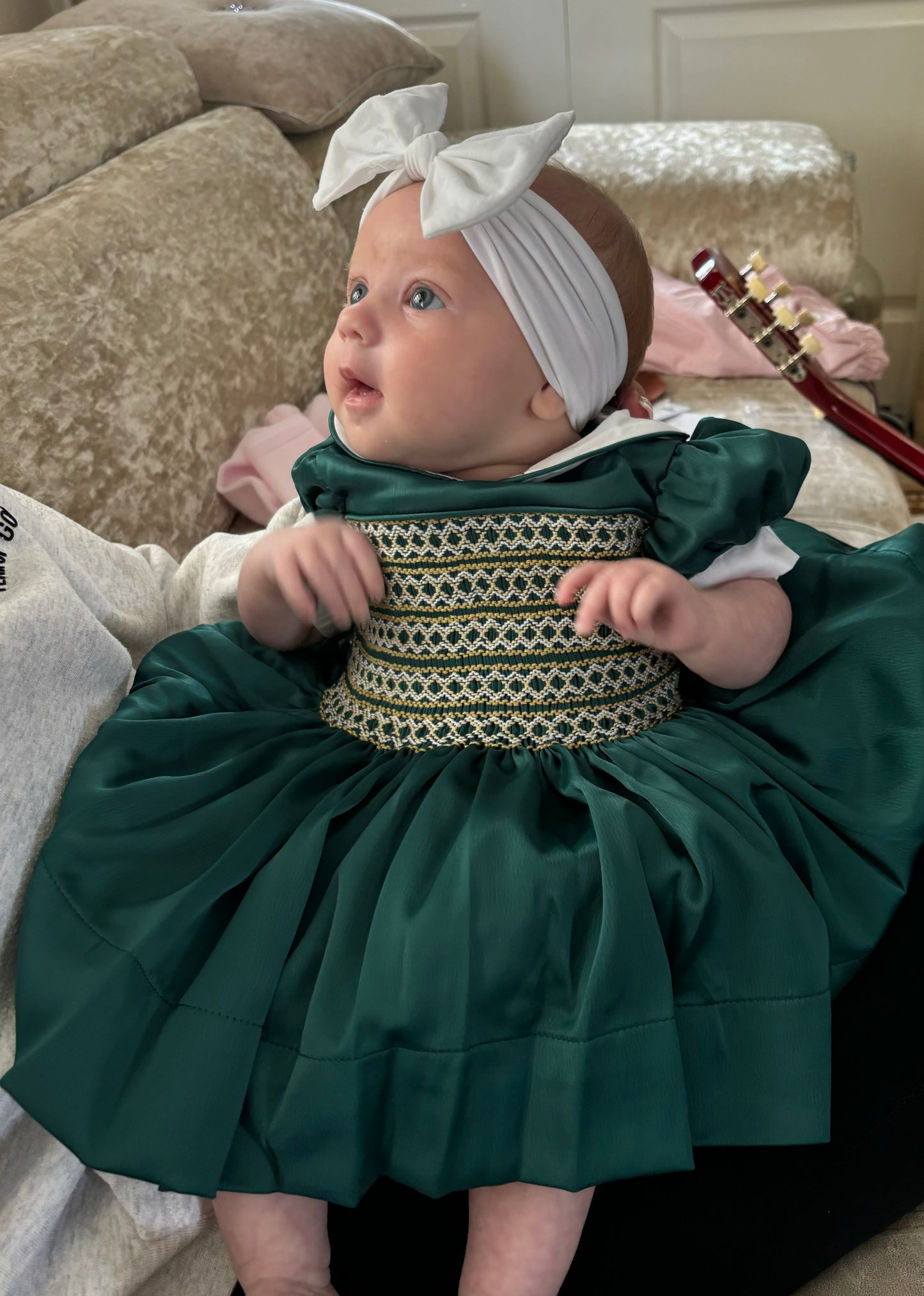 Emerald green satin with gold smocking