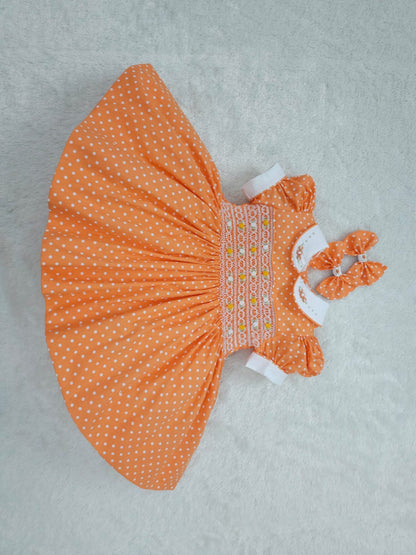 Orange polkadot smocked dress