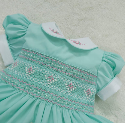 Mint with pink smocking and pearls