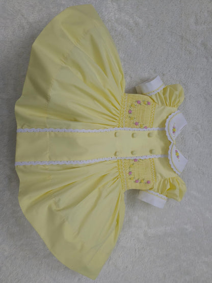 Lemon smocked garland dress with buttons on front